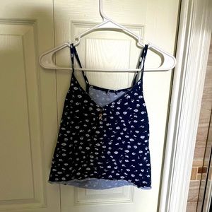 I’m selling this blue Hollister floral cropped cami tank top.